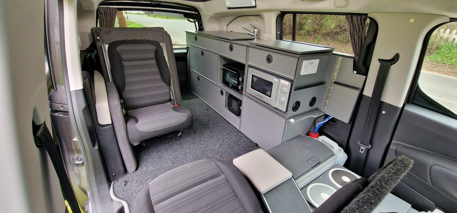The centre rear seat is unclipped and left at home when camping